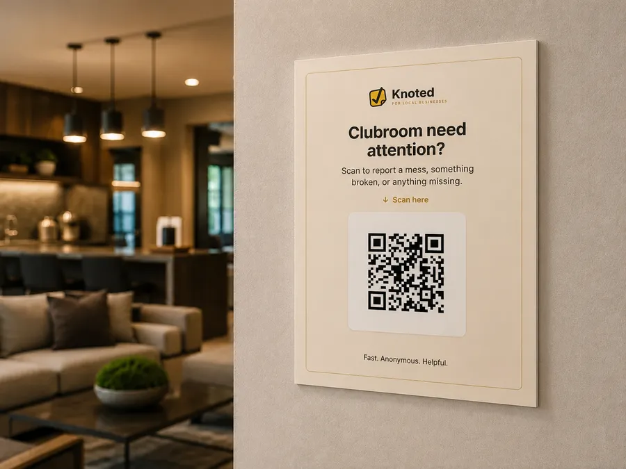 Knoted QR sign on an apartment clubroom wall for reporting messes or broken items