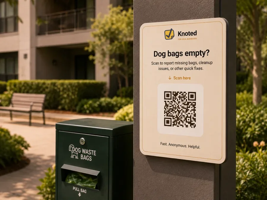 Apartment amenity QR sign at a pet waste station
